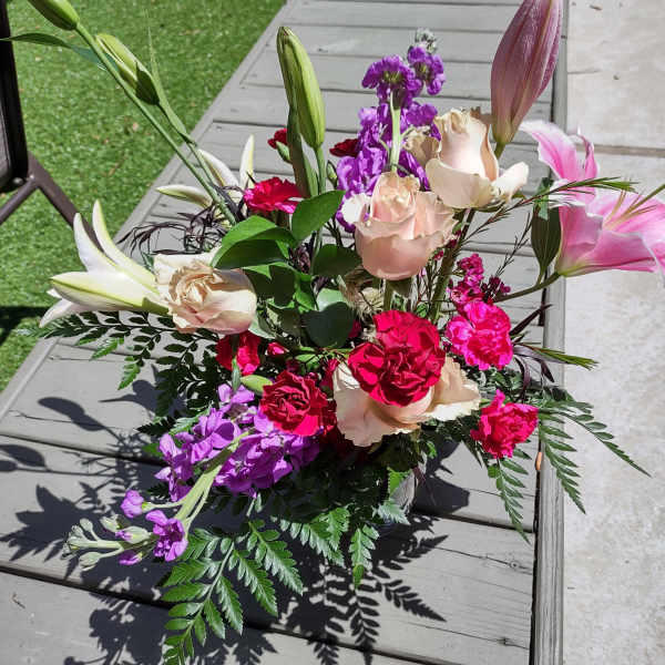 Mixed bouquet with pink lilies, roses, and purple flowers