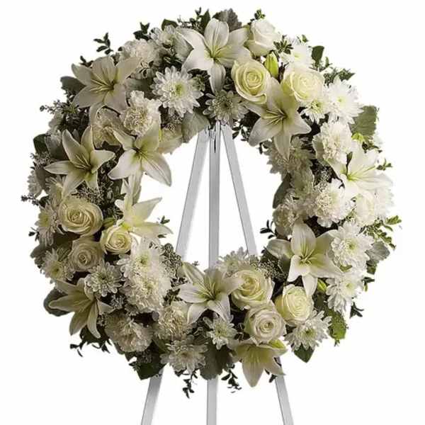 White floral wreath on a standing easel