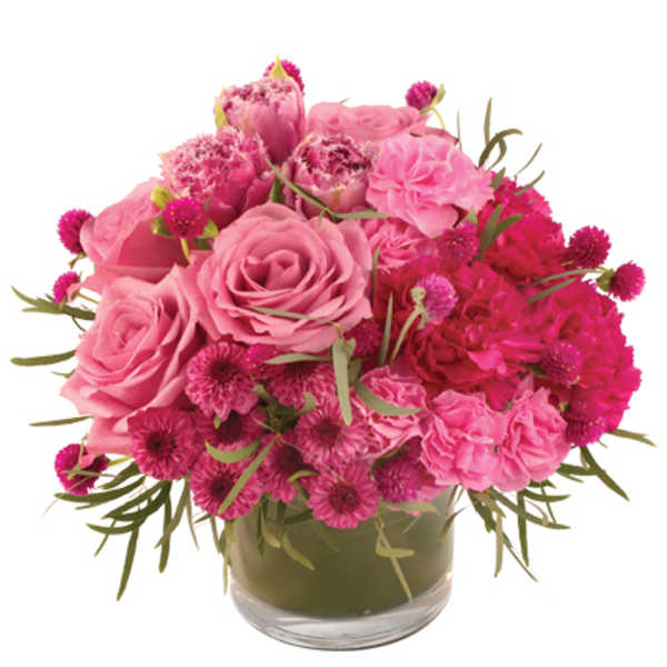 Pink roses and carnations in a glass vase