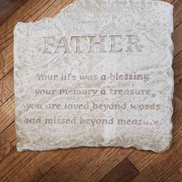 Memorial stone plaque with the word FATHER and a sympathy message