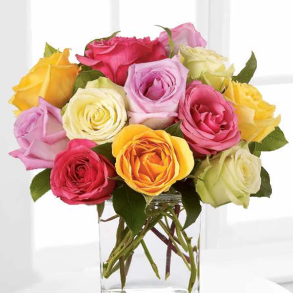Colorful rose bouquet in a clear glass vase
