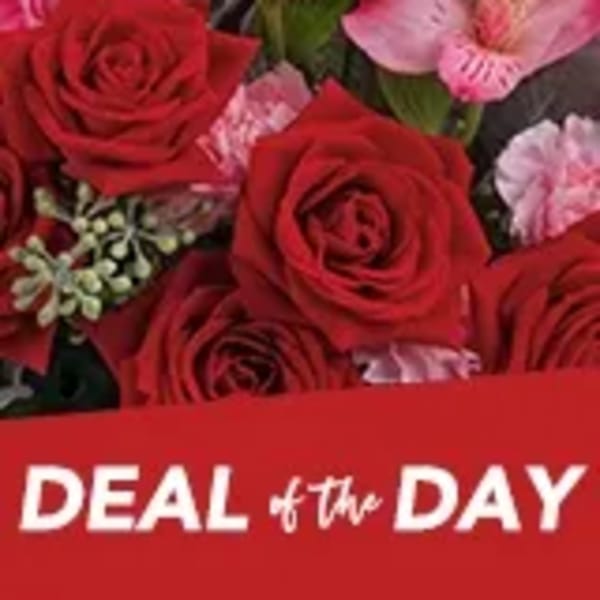 Red roses and pink flowers in a bouquet with a Deal of the Day banner