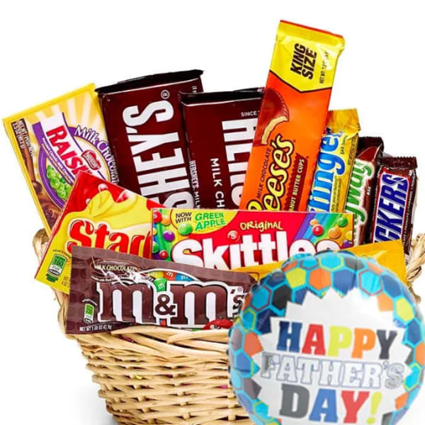 Basket of assorted candy bars with a Father's Day balloon