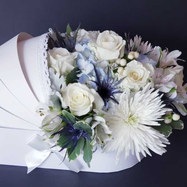 White rose bouquet with pale blue accents in a white box