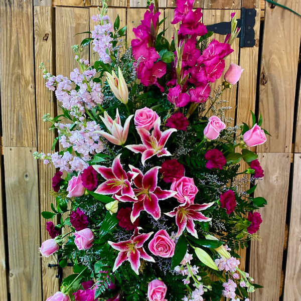 Tall standing floral spray with pink lilies and roses