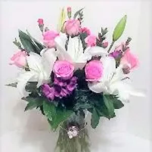 Pink and white mixed bouquet in a glass vase