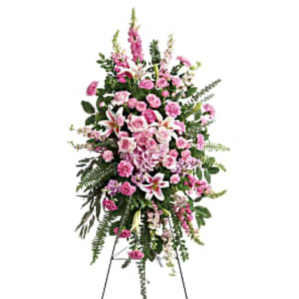 Tall pink and white floral standing spray on an easel