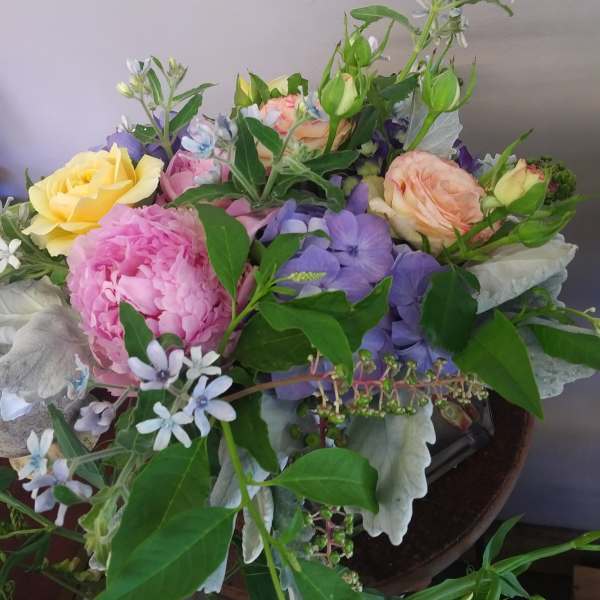 Mixed bouquet with pink, yellow, and lavender flowers