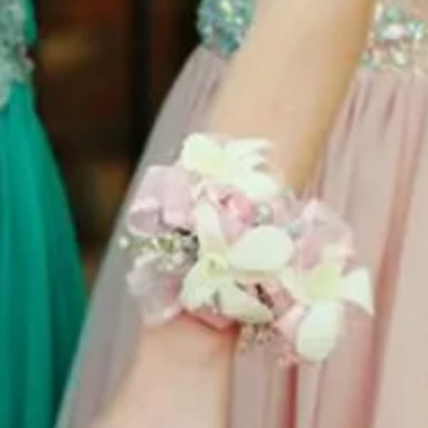 Pastel floral wrist corsage with white and pink flowers