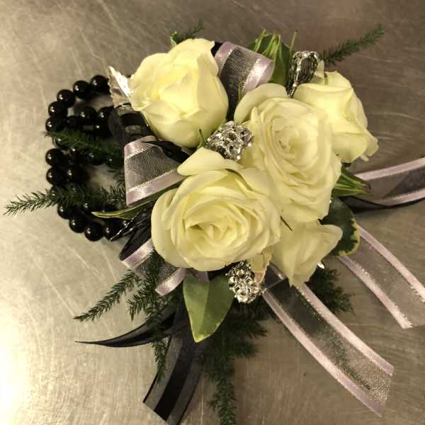 Cream rose corsage with black beads and silver ribbon