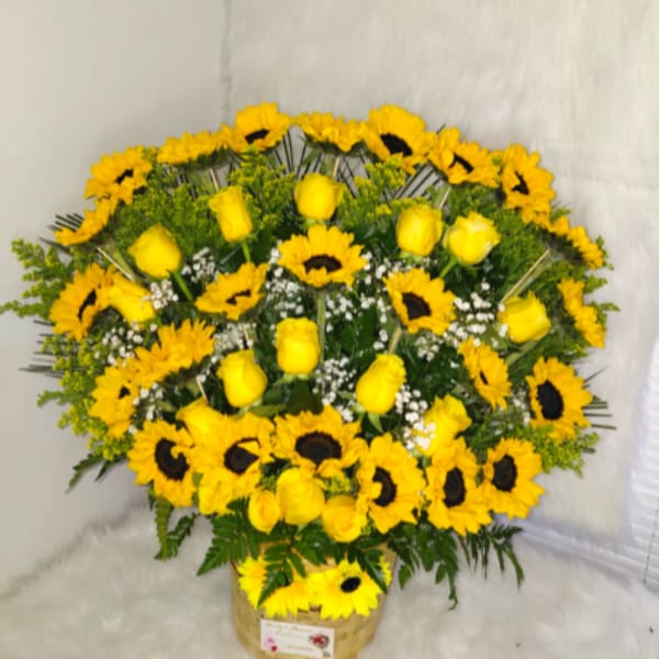 arrangement of sunflowers and yellow roses.