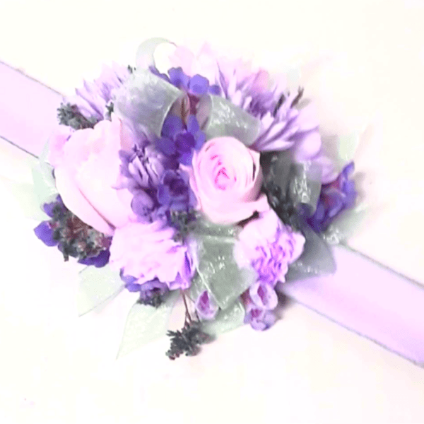 Lavender and pink floral wrist corsage with ribbon band