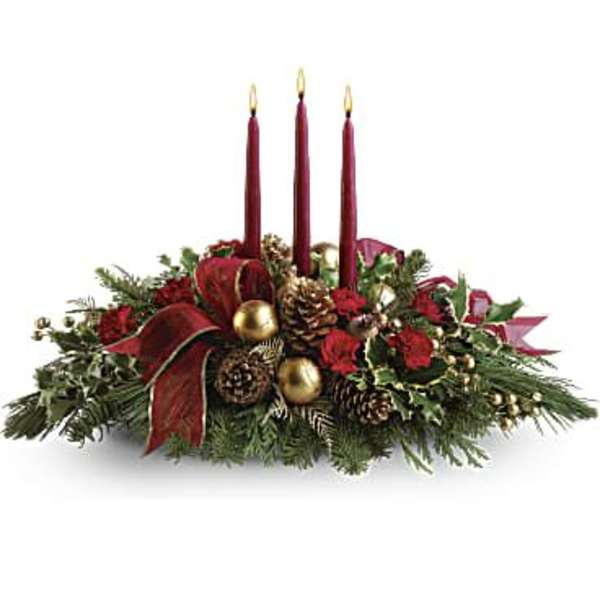 Holiday centerpiece with three red candles and pinecones