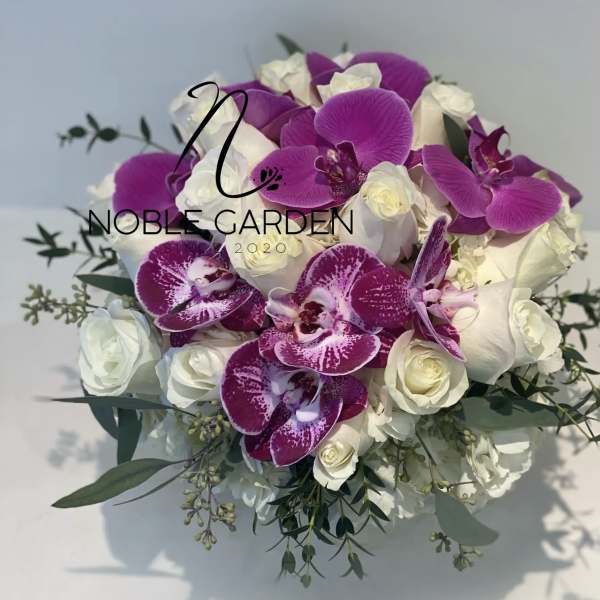 Bouquet of white roses and purple orchids