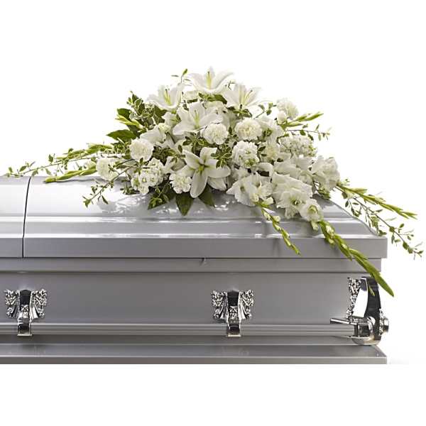 White floral spray on a silver casket