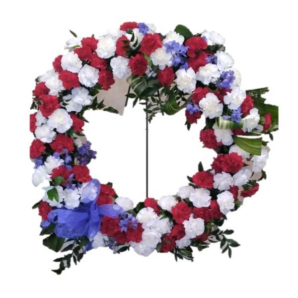 Circular floral wreath with red, white, and blue flowers