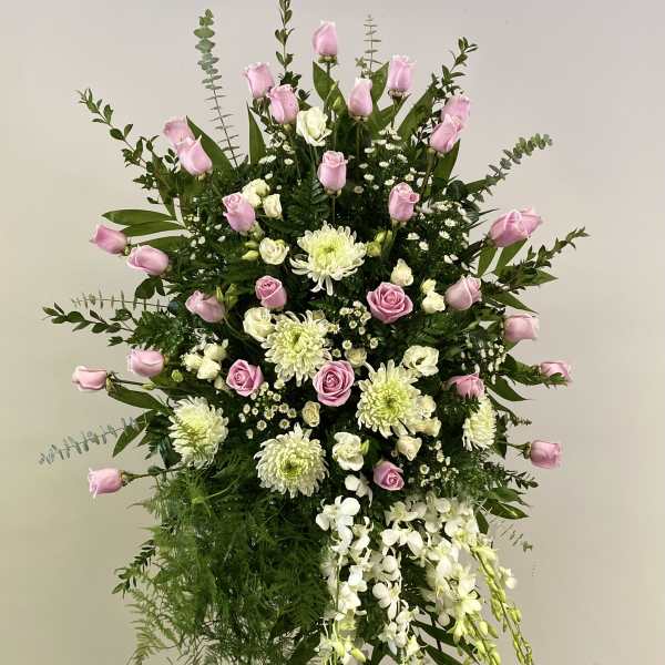 Tall standing floral spray with pink roses, white orchids, and white chrysanthemums