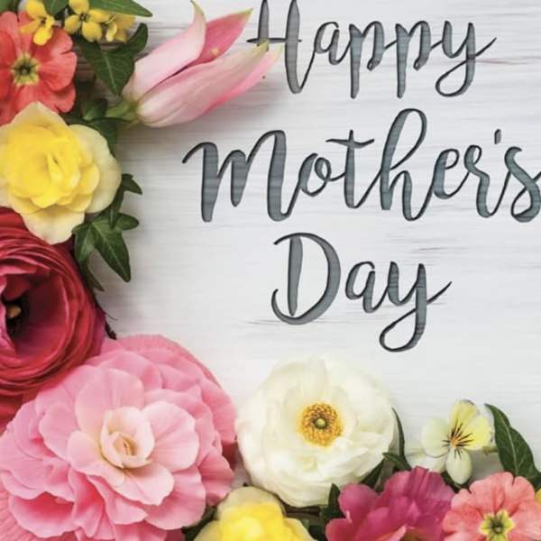 Colorful flower arrangement around a "Happy Mother's Day" sign