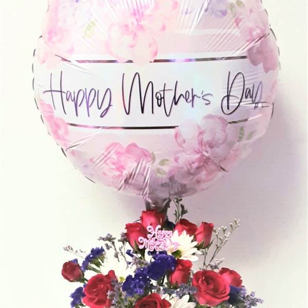 Mother's Day balloon above a red, white, and purple flower arrangement in a white pot