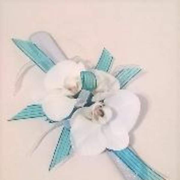 White orchid corsage with blue ribbon accents