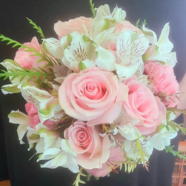 Pink roses and white alstroemeria bouquet with green accents