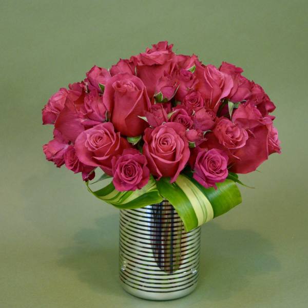 Pink rose bouquet in a striped silver vase