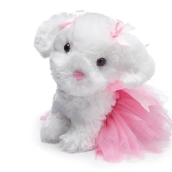 White plush puppy wearing a pink tulle dress and bow