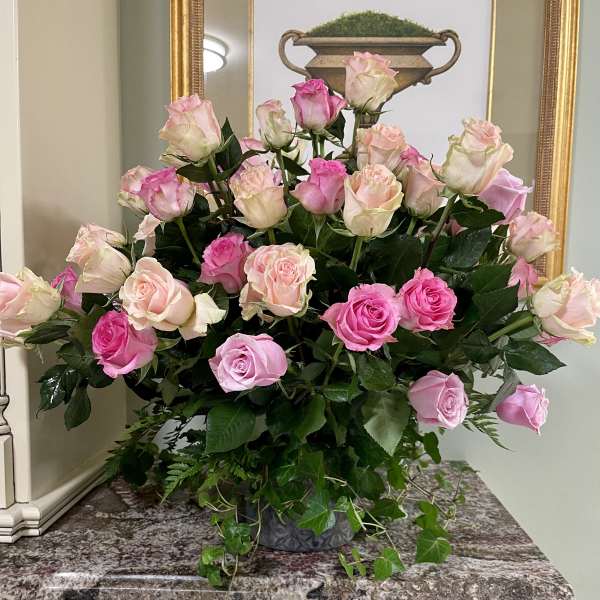 Bouquet of pink and blush roses in a decorative vase