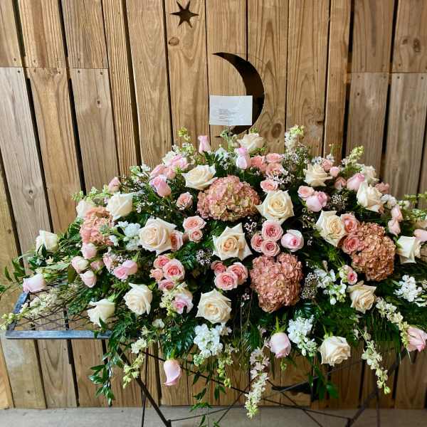 Large pink and white floral spray on a stand