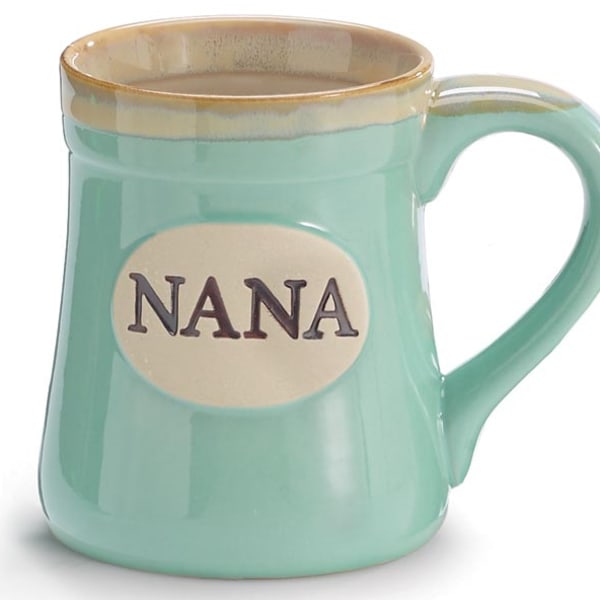 Mint green ceramic mug with the word "NANA" on a cream oval plaque.