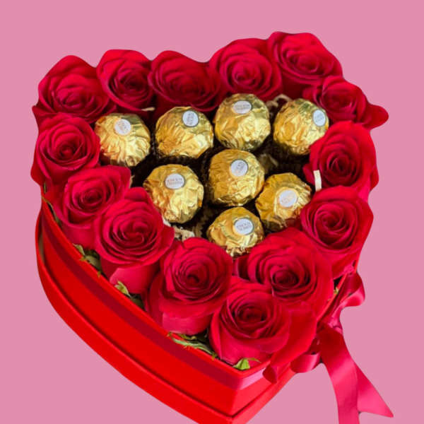 Heart-shaped box of red roses with gold-wrapped chocolates