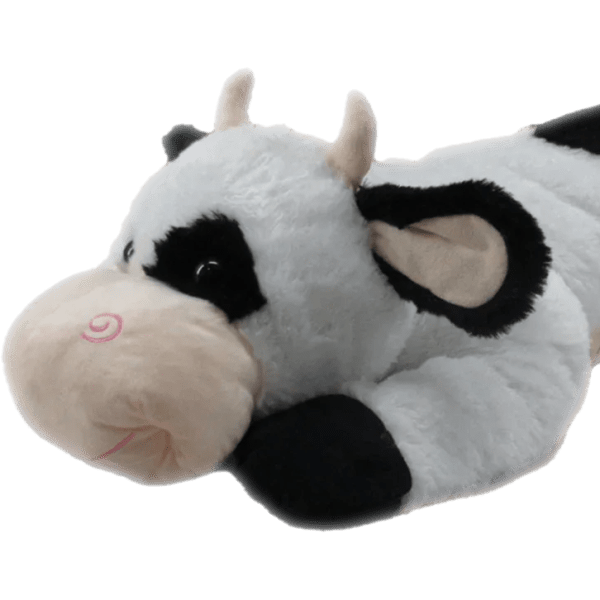 Plush cow toy lying on its side
