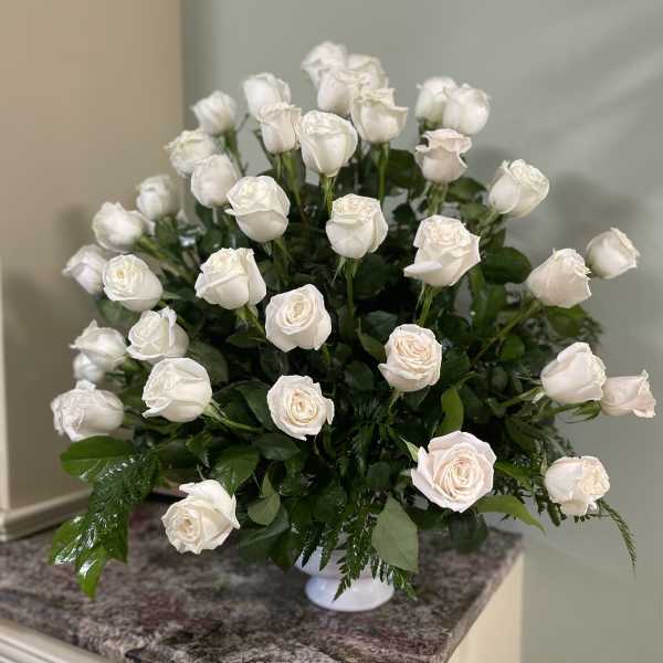 White rose bouquet in a white vase