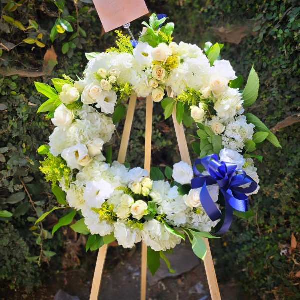 White and blue standing funeral wreath