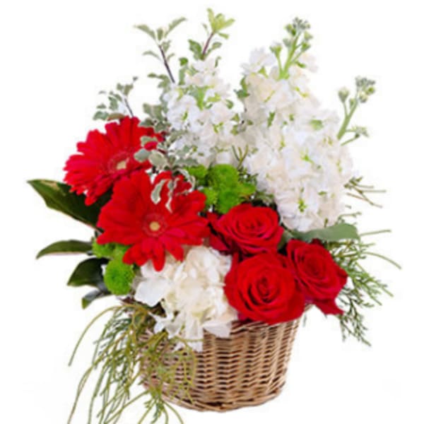 Red roses and white flowers arranged in a wicker basket
