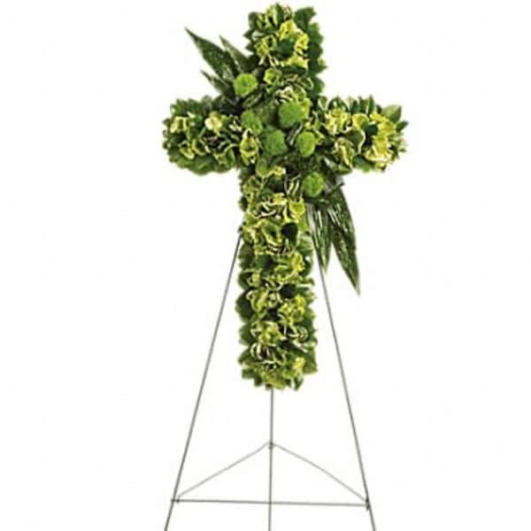 Green floral cross on a metal easel
