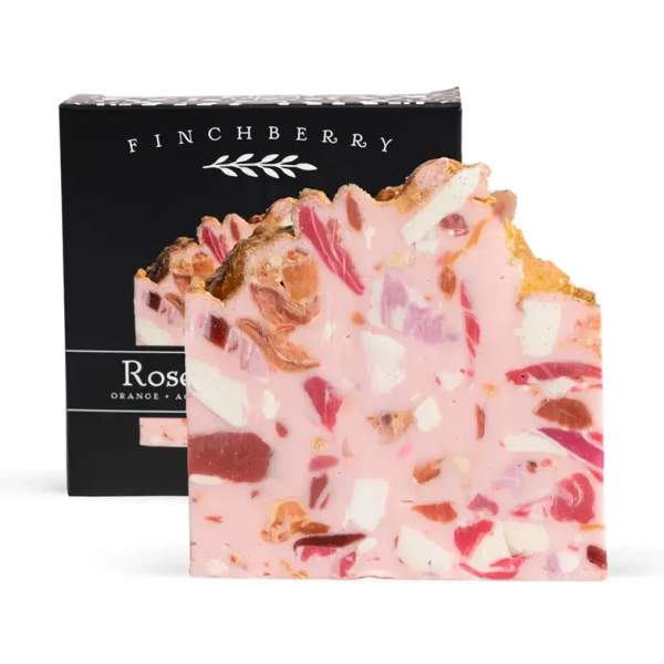 Pink marbled soap bar in front of a black Finchberry box