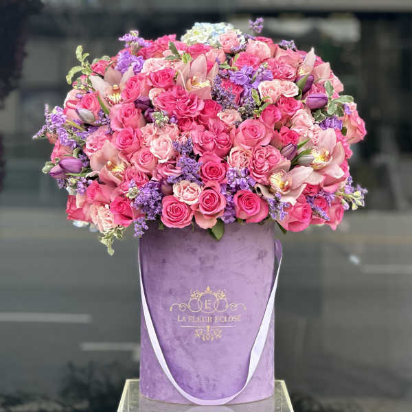 Large pink and purple rose bouquet in a lavender hat box