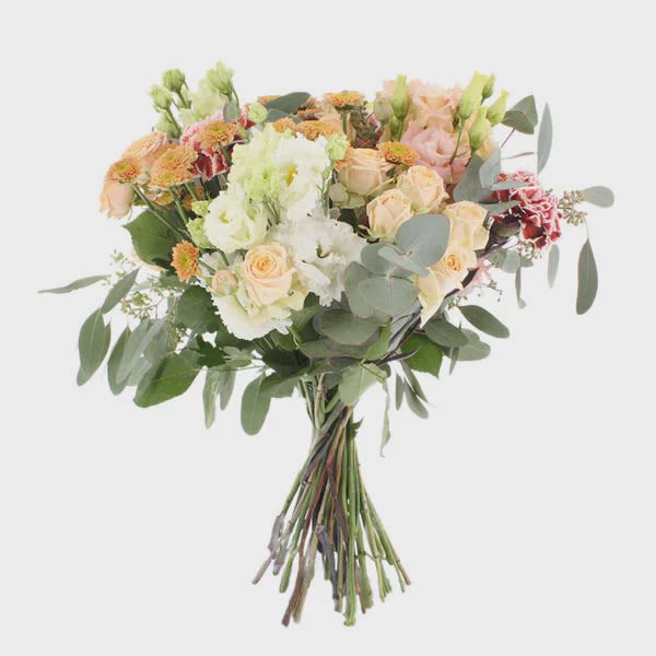 Hand-tied bouquet of peach and white flowers with eucalyptus