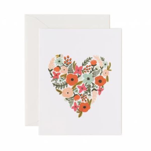Greeting card with a floral heart design on the front