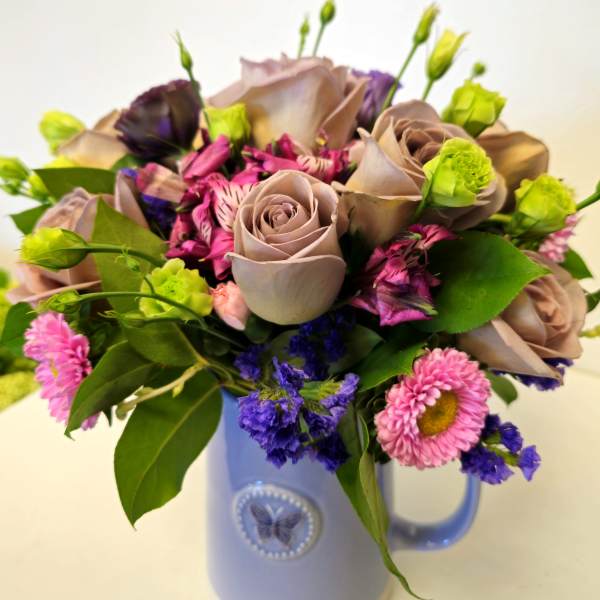 Beautiful arrangement in clay vase