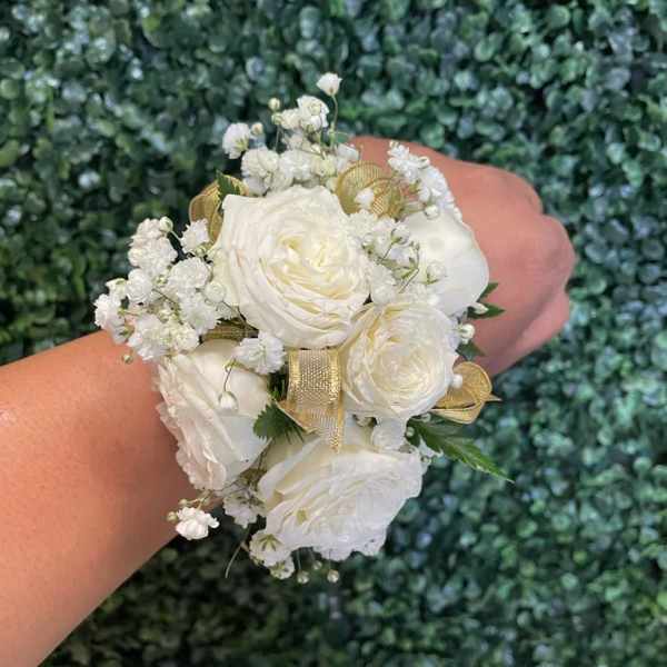 White rose wrist corsage with baby's breath and gold ribbon