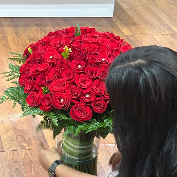 Large bouquet of red roses in a glass vase