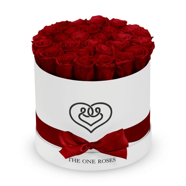 Round box of red roses with a red ribbon and heart logo