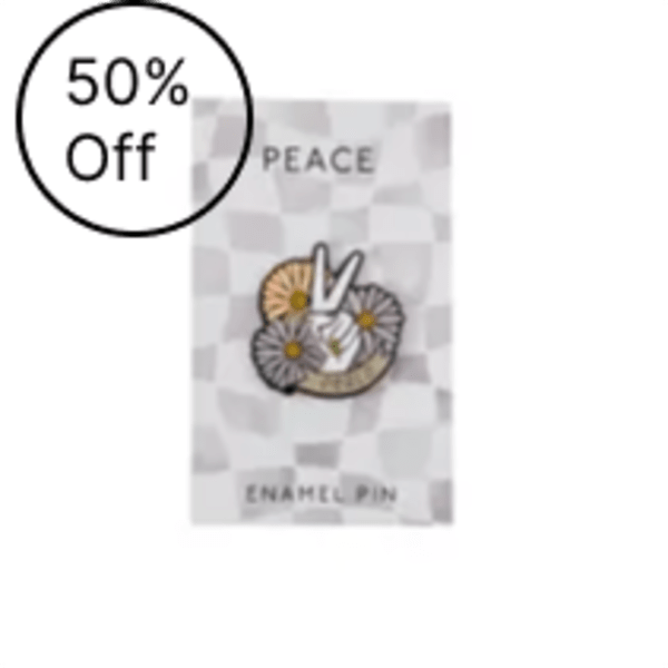 Packaged enamel pin with a peace sign and flowers