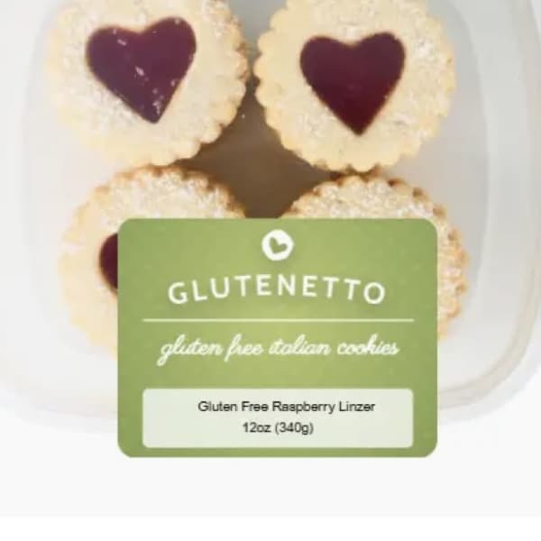 Container of heart-shaped raspberry linzer cookies