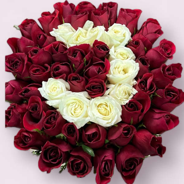Bouquet of red and white roses arranged in a round cluster