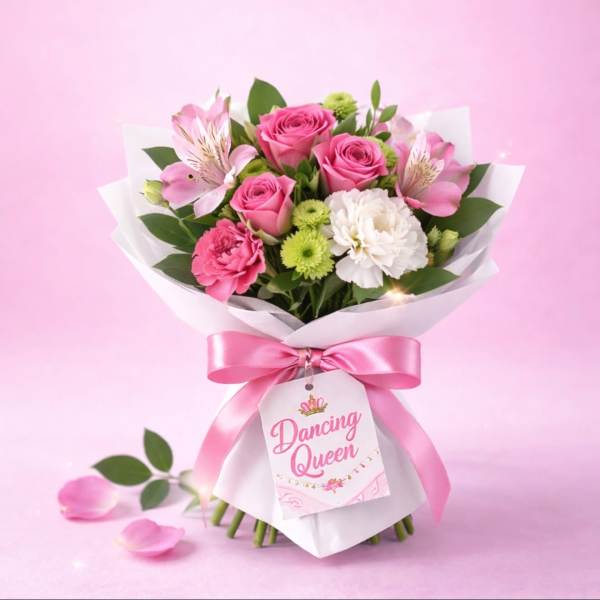 Pink rose bouquet with carnations and white blooms wrapped in white paper