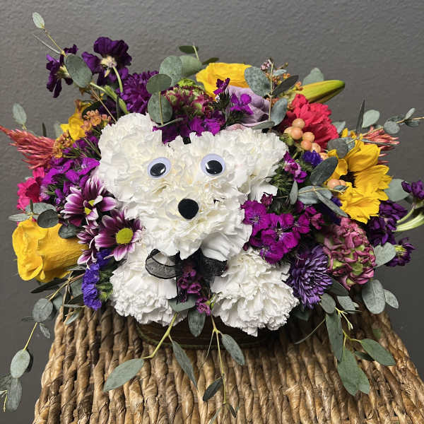 White floral teddy bear arrangement with purple and yellow flowers