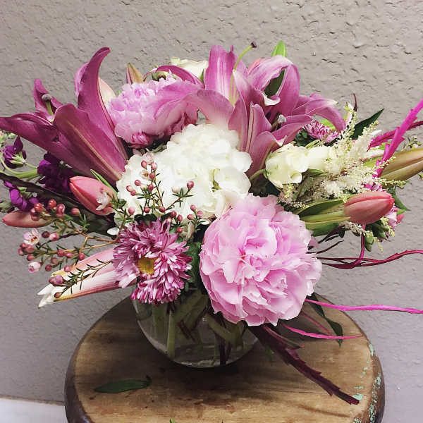 Pink and white mixed bouquet in a clear glass vase